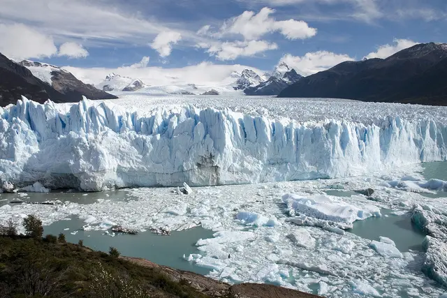 The jagged blue-white ice front of the Perito Moreno Glacier meeting Lago Argentino