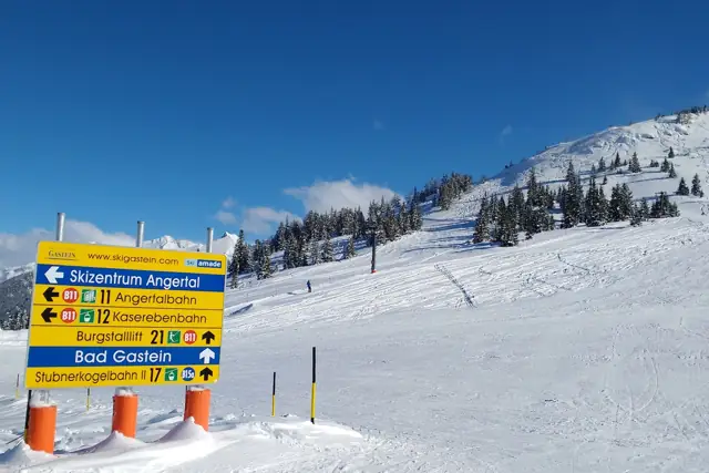 A groomed ski piste with signposts on the Stubnerkogel above Bad Gastein, Austria