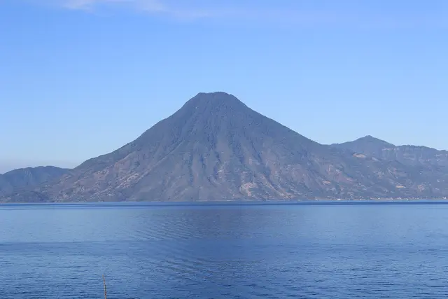 San Pedro volcano rising above the calm blue water of Lake Atitlán